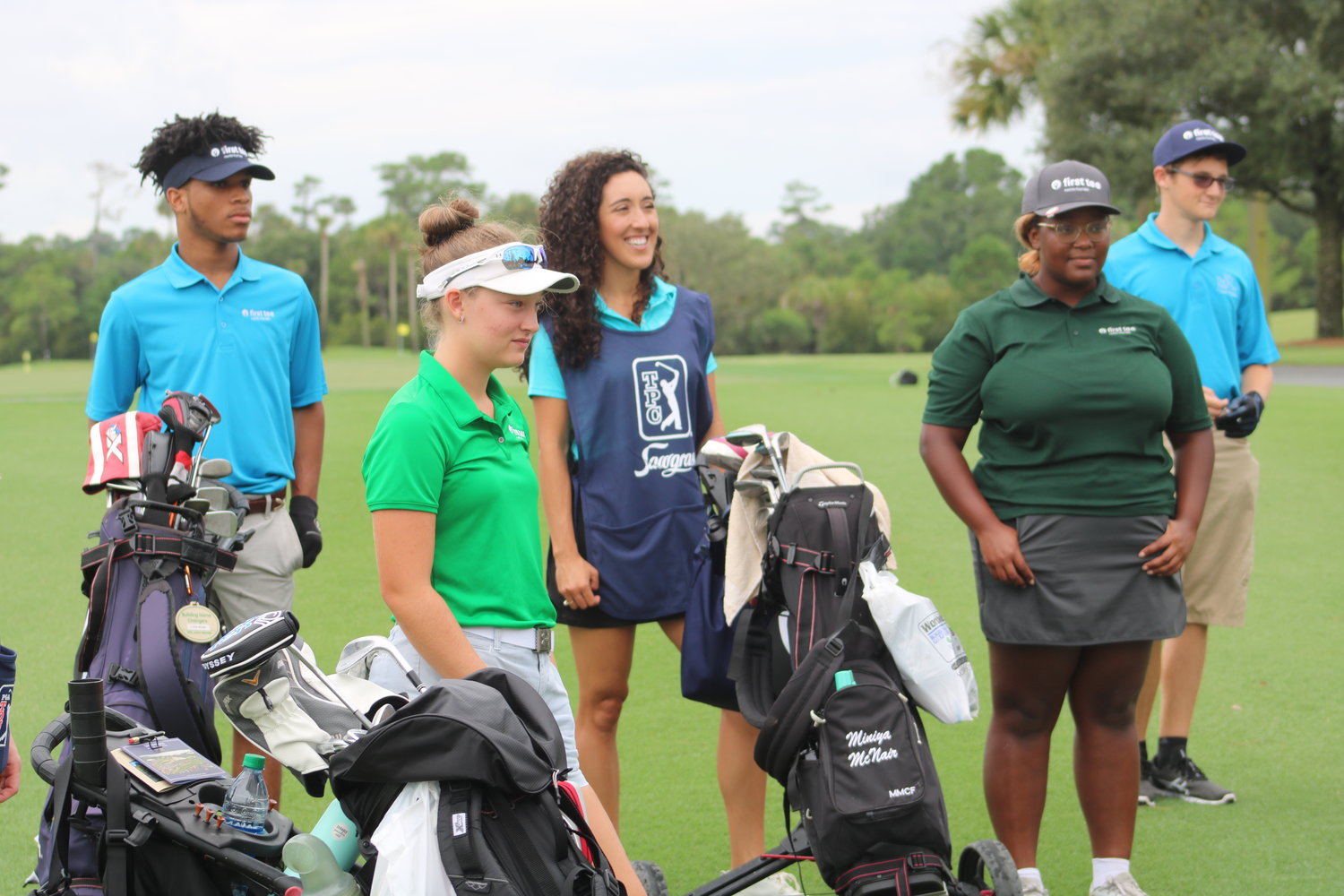 First Tee of North Florida members Tyson Brown, Katarina Hoag, Miniya McNair and Matthew Olsen await the start of a round at THE PLAYERS Stadium Course at TPC Sawgrass on Aug. 5.